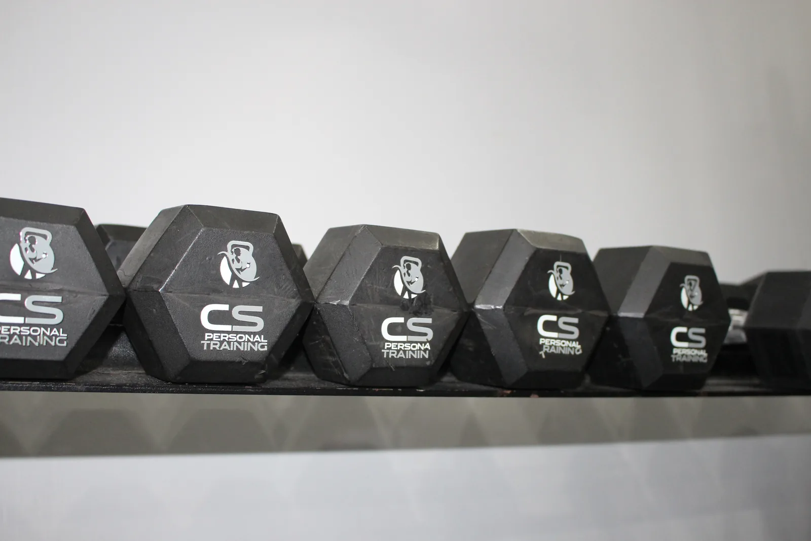 The dumbbell racks in the studio.