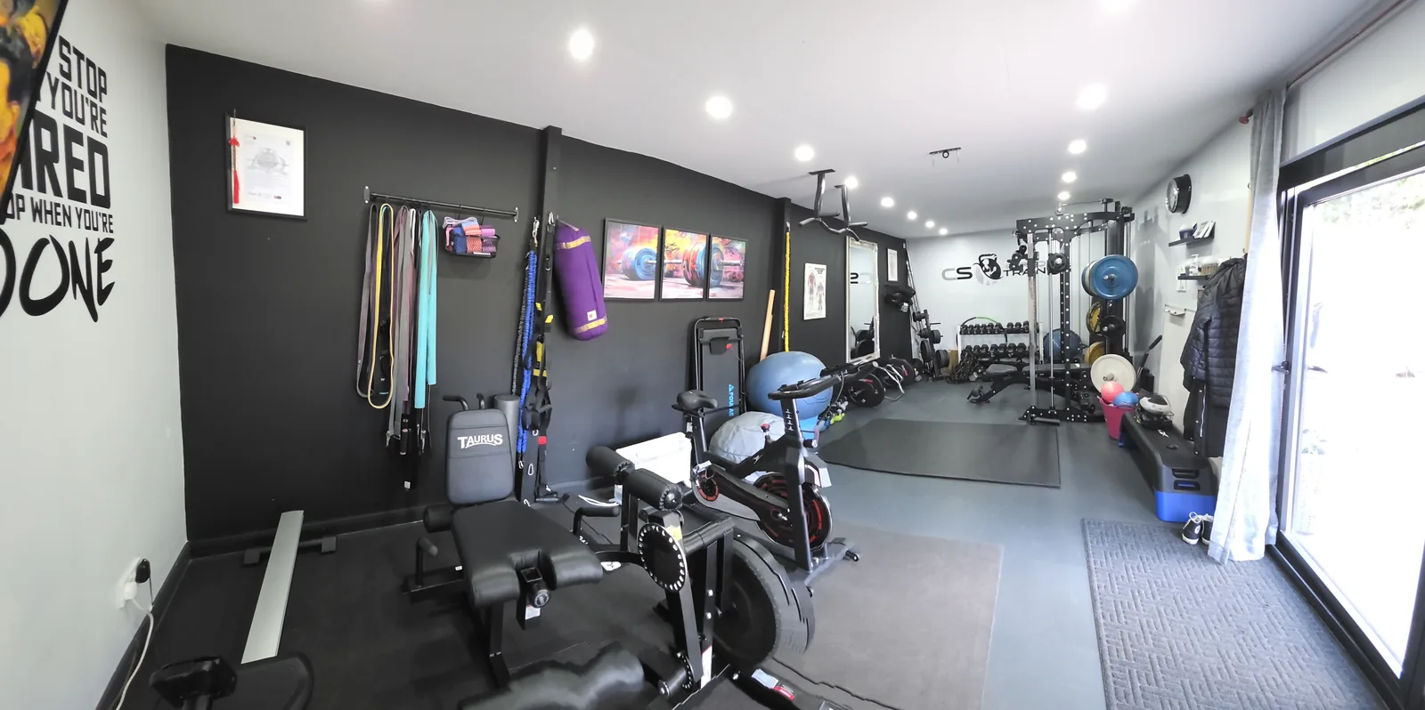 The CS Personal Training studio, empty, with the rack and benches set up.